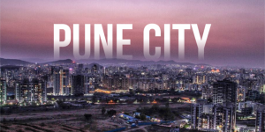 Scenic view of Pune city with historic Shaniwar Wada, modern skyline, and lush green surroundings.